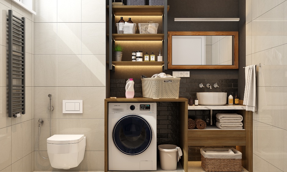 1 bhk apartment bathroom has a vanity unit, open shelves, and space for the washing machine.