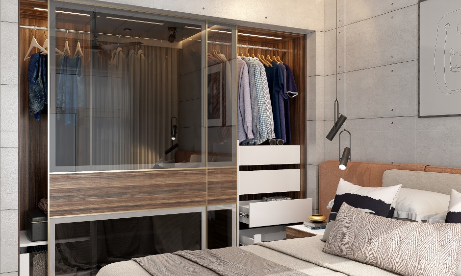 1 bhk home design, bedroom wardrobe has a modular sliding wardrobe with frosted glass front.
