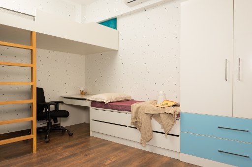 2 BHK flat bedroom displayed with wardrobes at DesignCafe experience centre in navi mumbai