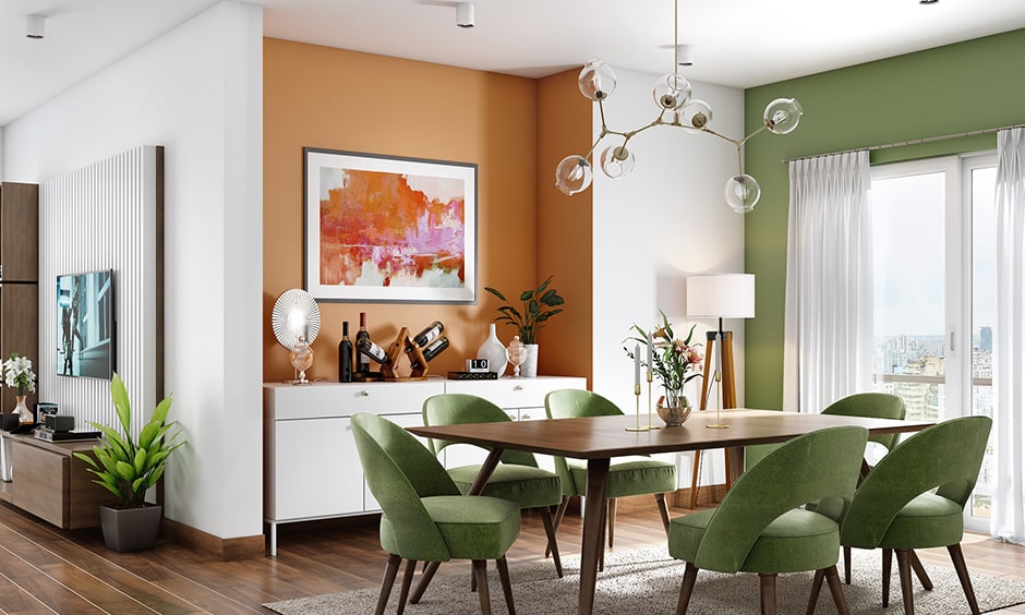 Two colour combination for dining room with a muted shade of green and pale orange