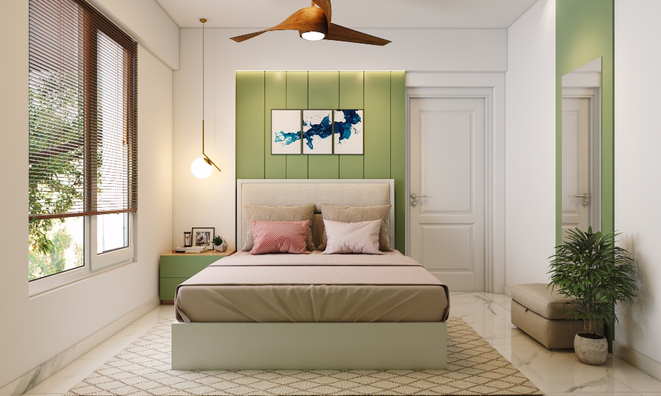 Green and white 2bhk design bedroom with a pendant hanging light on one side