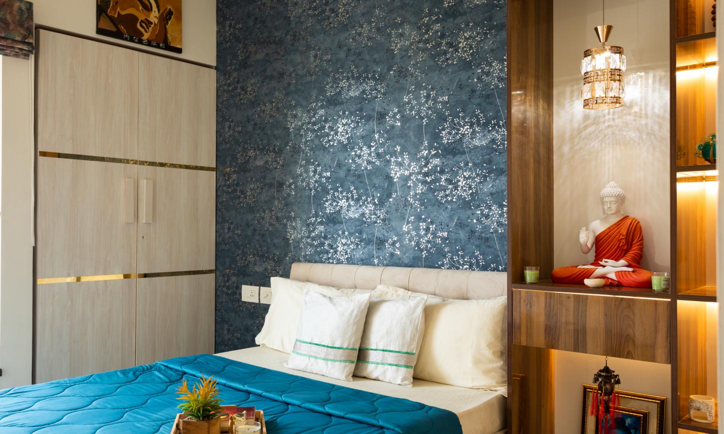 Designcafe designed the master bedroom of a 2 BHK apartment in Thane, featuring a built-in wardrobe