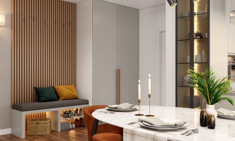 A dining area designed with a four-seater dining table and a tall crockery unit designed by interior design ideas for 3bhk flat