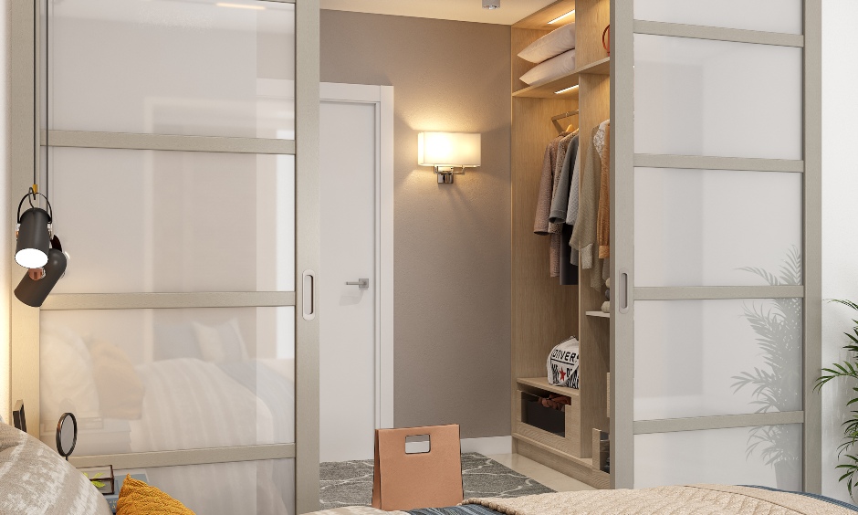 A lavish bedroom with a walking closet, a bed in a 3bhk flat interior design