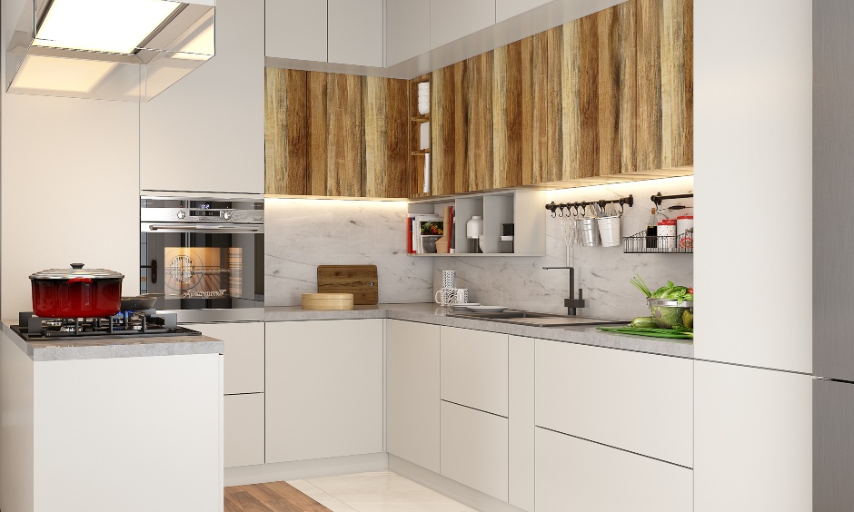 A modern G-shaped kitchen designed in white and wood for a 3bhk interior design to create a striking contrast