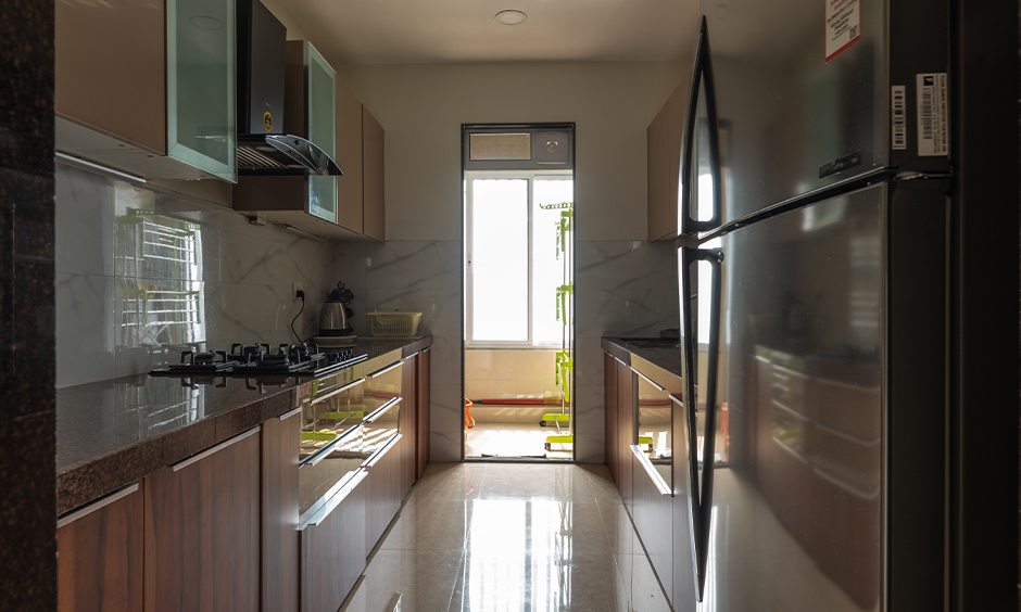 Parallel kitchen with overhead cabinets designed by affordable interior designers in mumbai