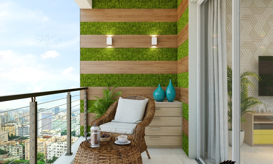 Balcony wall in 1 bhk home designed with wooden rafters and artificial grass lends the vibe of a vertical garden