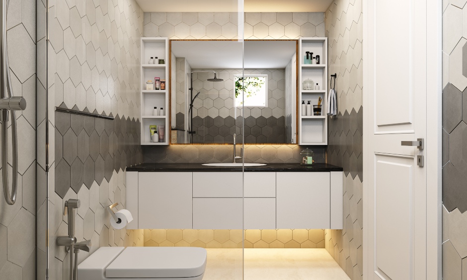 Bathroom in 2bhk house designed with hexagonal wall tiles and vanity has push-to-open drawers