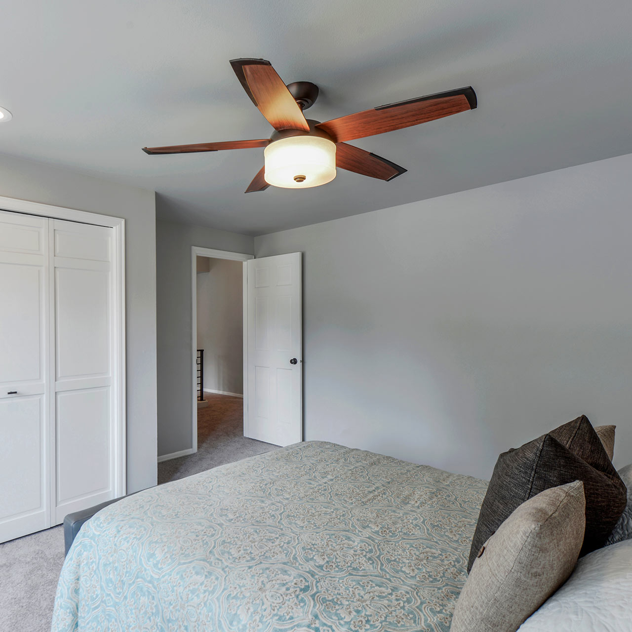 Simple bedroom interior design with a ornamental ceiling fans and hi-tech silent fan designs