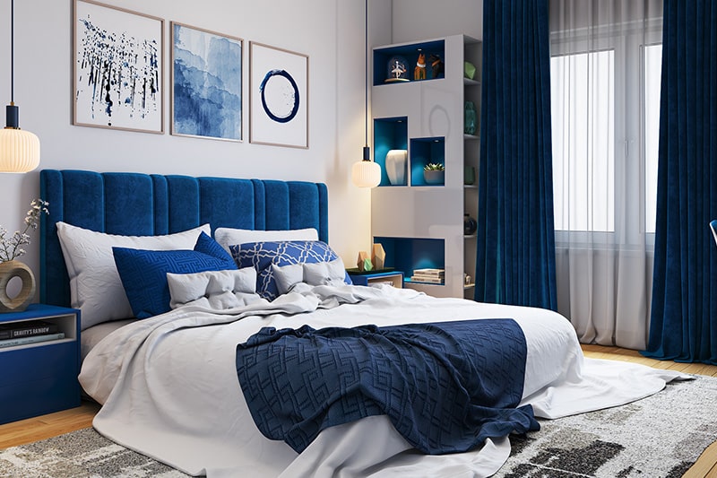 Bedroom colour combination with white painted walls and classic blue headboards