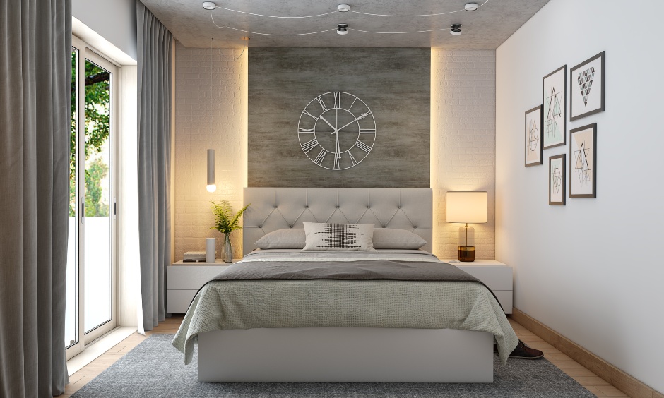 Bedroom colour design in neutral with accent wall behind the bed is flanked with a drop-down pendant light