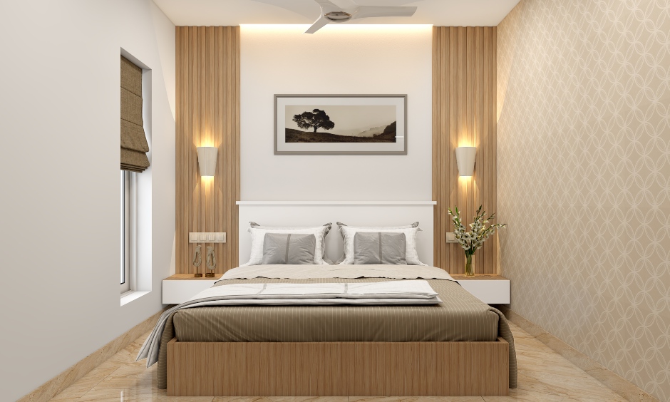 The bedroom in 1 bhk apartment finished in wood lends a sense of warmth with wooden panels behind the headboard