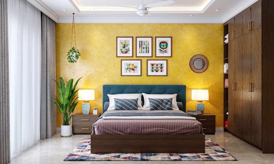 Yellow textured wall bedroom with four-door wardrobe design in 3bhk home