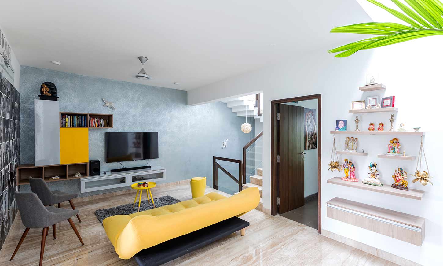 Good interior designers in bangalore with a bold yellow sofa in living room