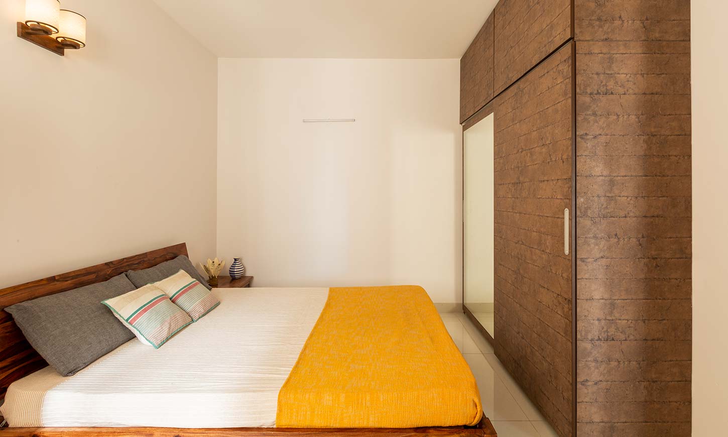 Bedroom interior with wardrobe and loft designed by best interior design firms in bangalore