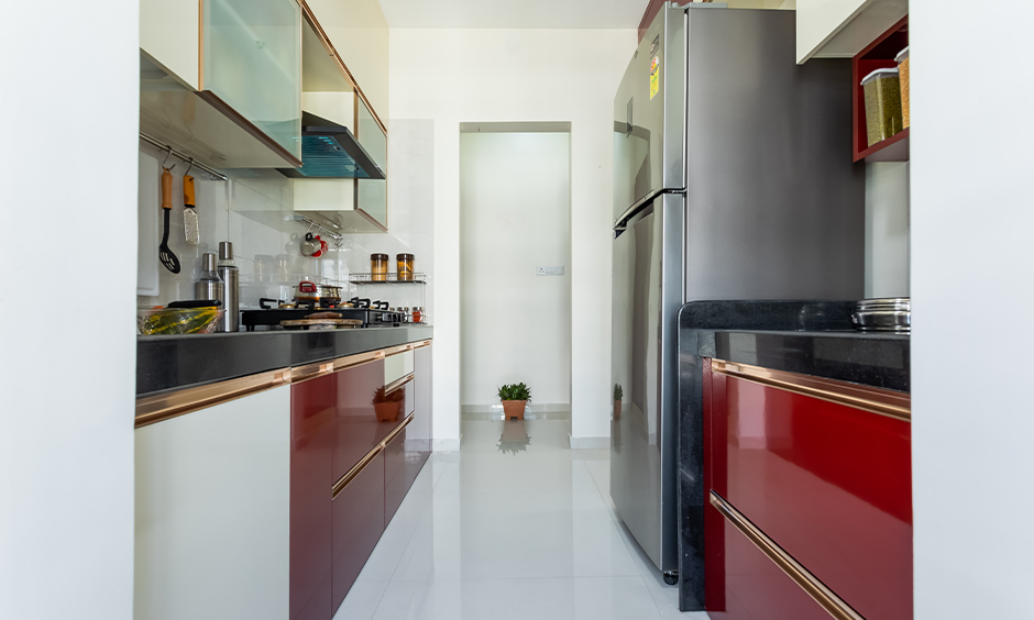 A red parallel kitchen with best interiors in mumbai