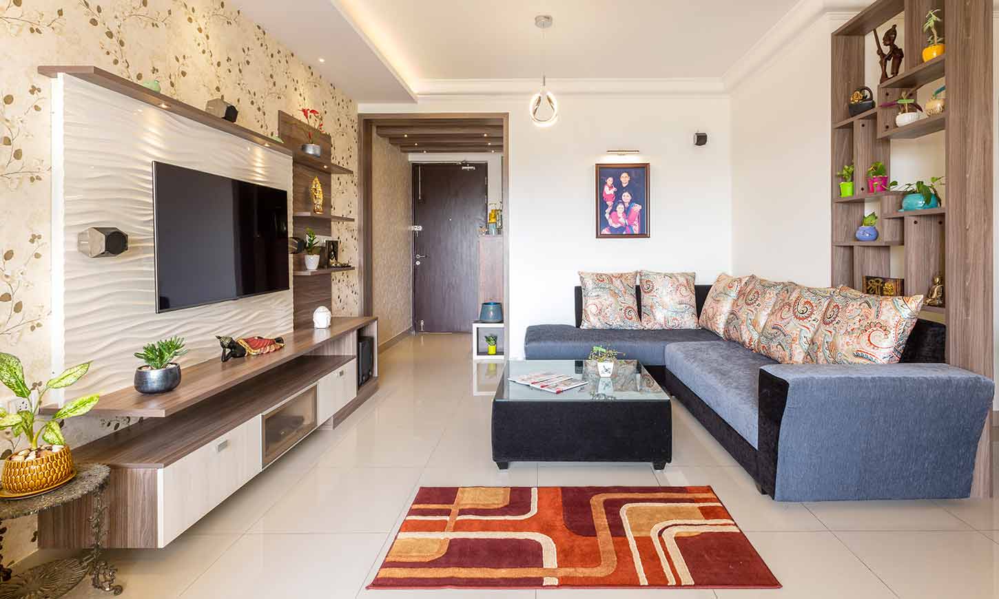 Living room designed by budget interiors in bangalore with tv unit and showcase