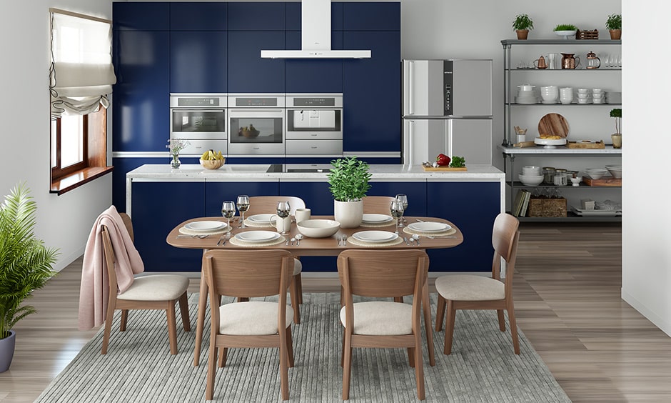 Dining room colour combination with blue cabinets, wooden furniture and white walls