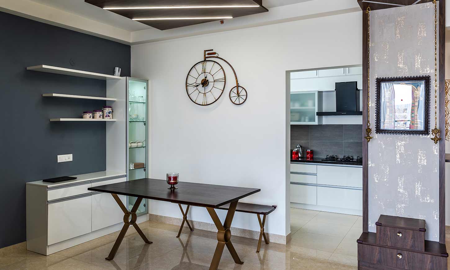 Dining room design with a crockery unit by interior design company in bangalore