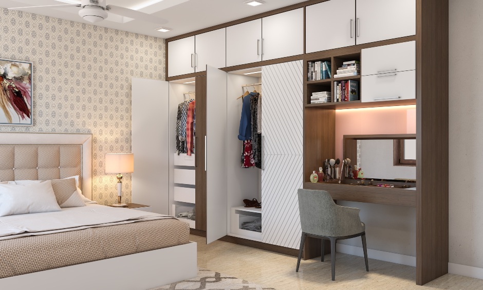 Wardrobe with 4 doors has a combination of glass-fronted and handleless drawers for a modern look wardrobe