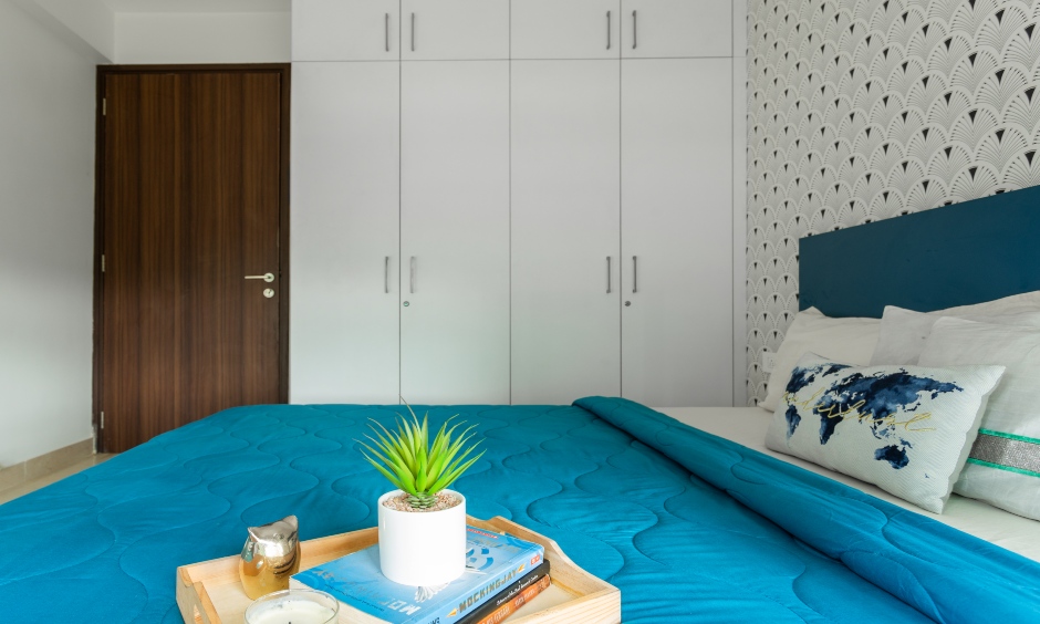 Gorgeous master bedroom with a white laminate designed by best interior designers in mumbai