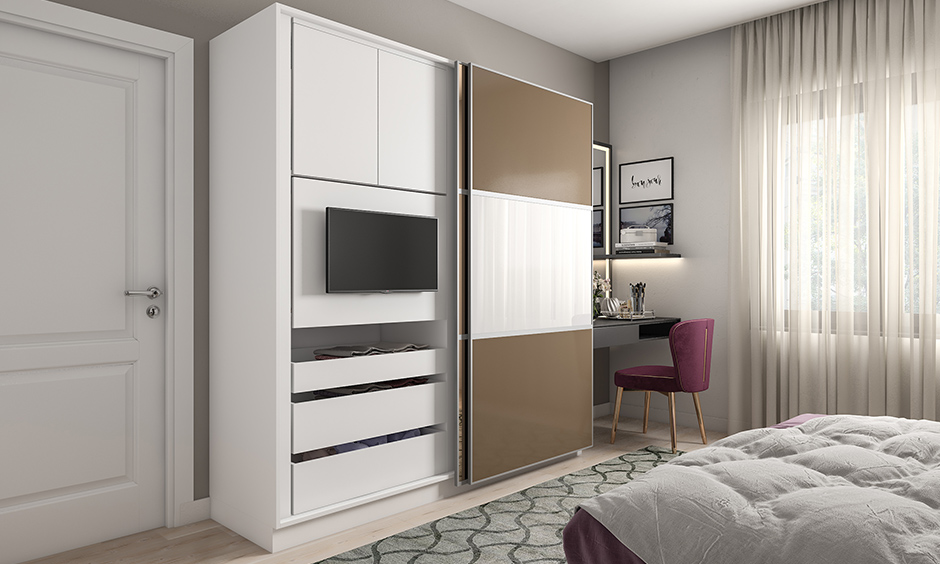 Multifunctional sliding wardrobes with a TV unit is an excellent way to make the most of your guest bedroom space.
