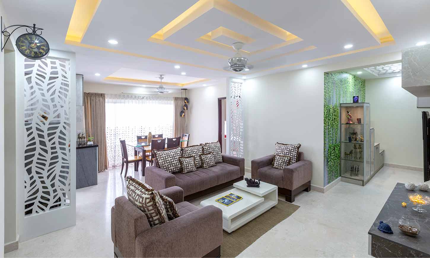 Living room interior with sofa set and dining table designed by home decorators in bangalore