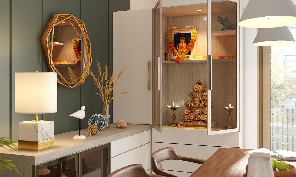 A stunning pooja unit with a cabinet glass front on the other side designed in home design 2bhk