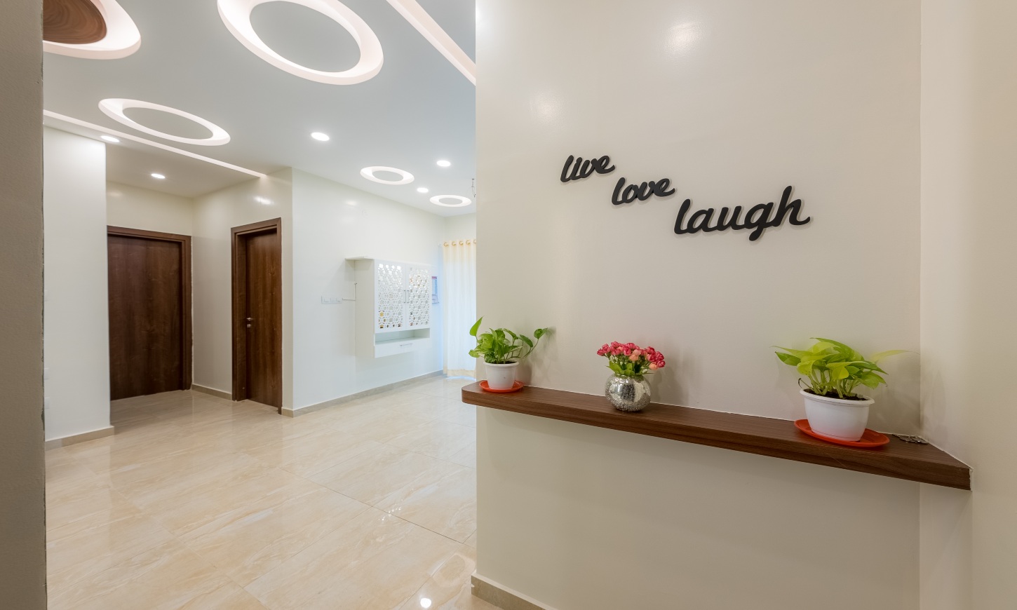 Designcafe designed a minimalist entrance for Assetz 63 degree apartment, Sarjapur Road