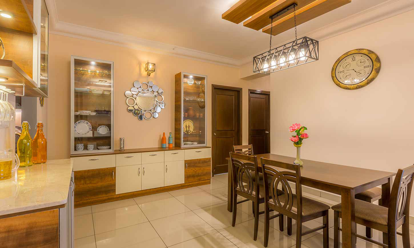 Dining room with crockery cabinet designed by home interiors bangalore
