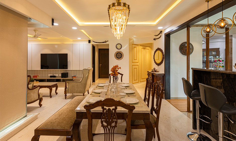 Home interiors mumbai where the dining room borrows its design from traditional Indian style furniture styles