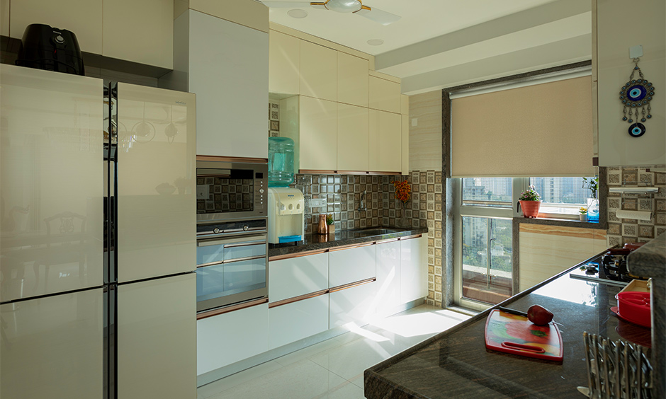interior architects in mumbai where the kitchen is equipped with cutting edge storage units, personalised for the family's lifestyle