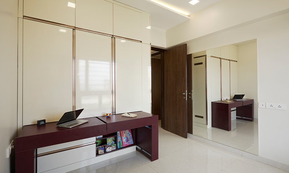 Bedroom with study table pullout wardrobe designed by interior design company in mumbai