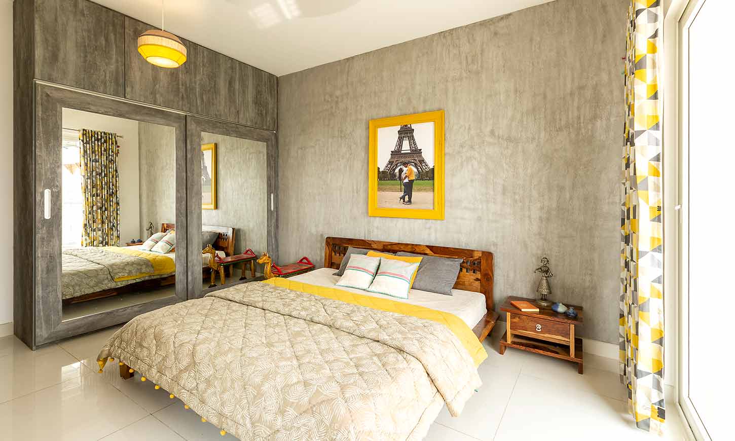 Bedroom designed with big glass wardrobe for interior design services in bangalore