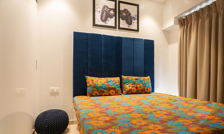 A blue bedroom designed by interior designers & decorators in mumbai