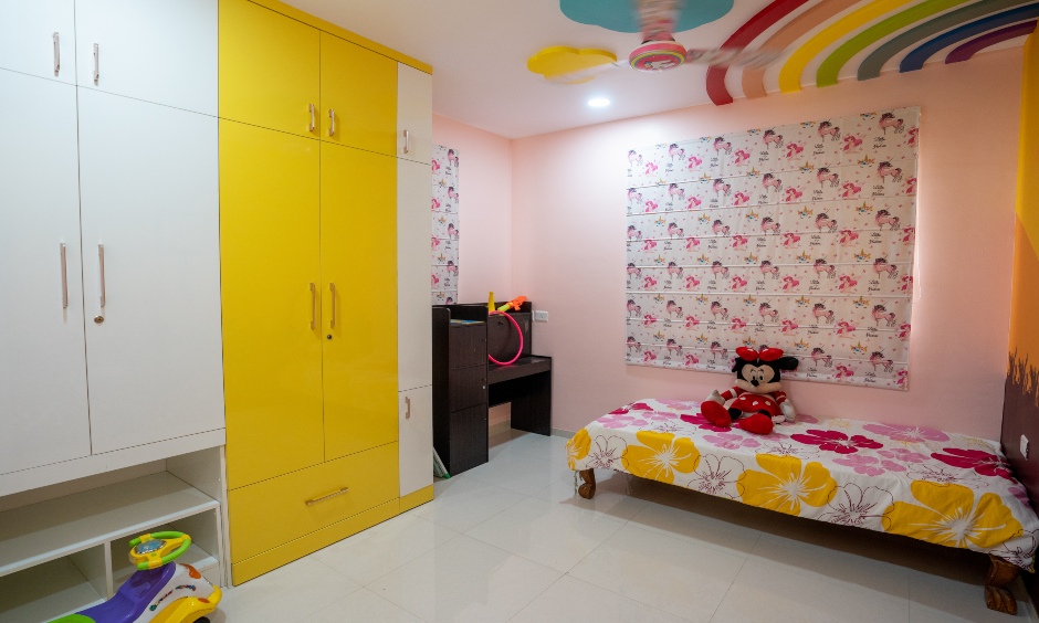 Kids bedroom with floor-to-ceiling wardrobe and a compact study unit designed by famous interior designers in hyderabad