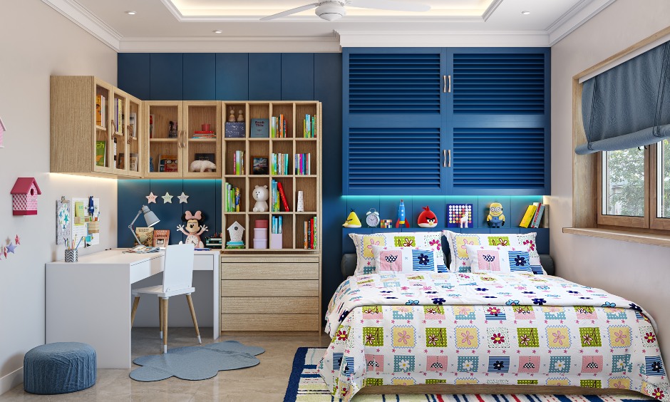 Blue and white kid's bedroom has L-shaped study desk with an attached bookshelf in 3bhk home