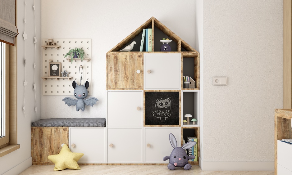 Kids storage unit designed in the shape of a hut to keep toys and books in a clutter free manner in 2bhk room design
