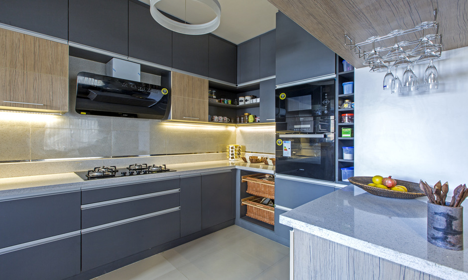 Under-cabinet lights add depth and brightness to your low-budget small kitchen ideas