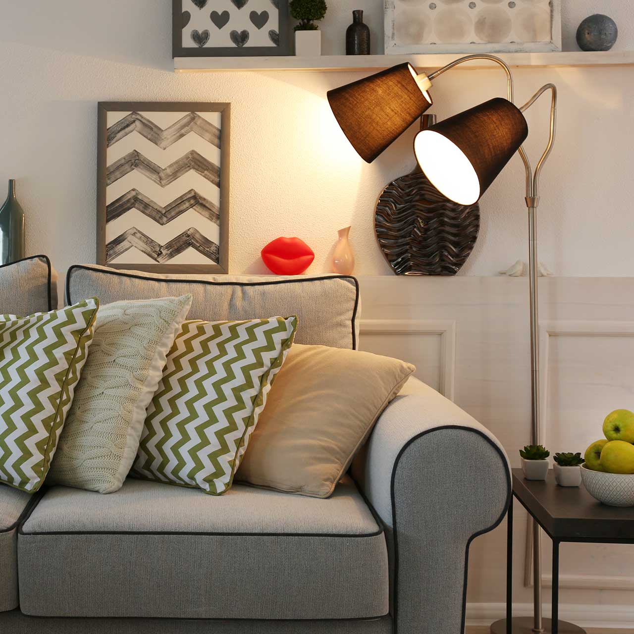 Cozy living room interior with sofa and floor lamps in close up