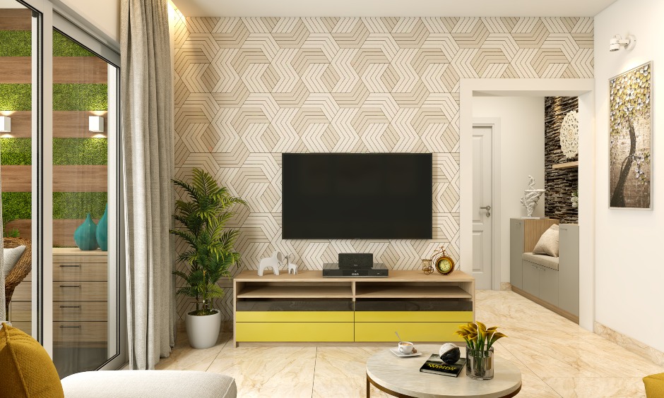 Living room in 1 bhk flat designed with textured wallpaper behind the entertainment unit adds texture to the interior design