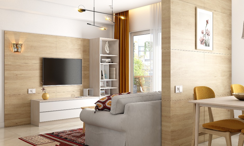 Living room in 2bhk interior designed in wood and white oozes a Scandinavian vibe