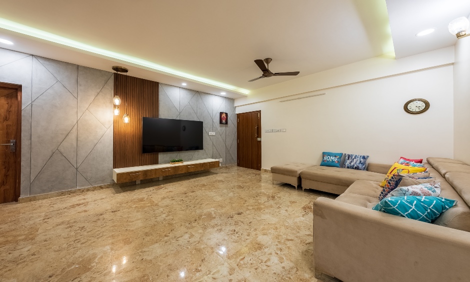 3 BHK Flat living room TV unit with wood panel backdrop designed by an interior designer in Bangalore