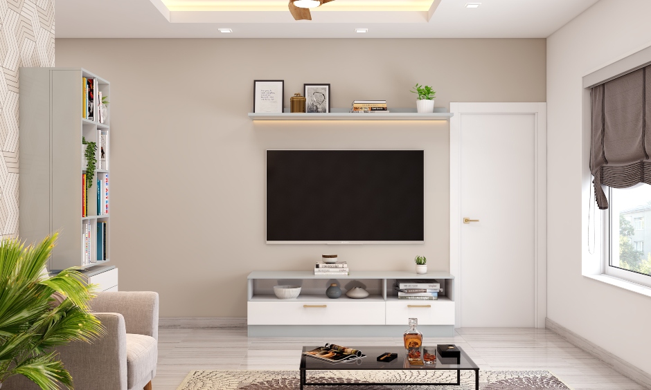 Living room tv unit is designed with a sleek cabinet below with open shelves