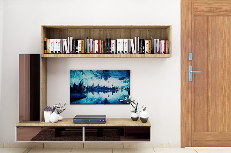 Living room wall decor that has shelves to stack up books