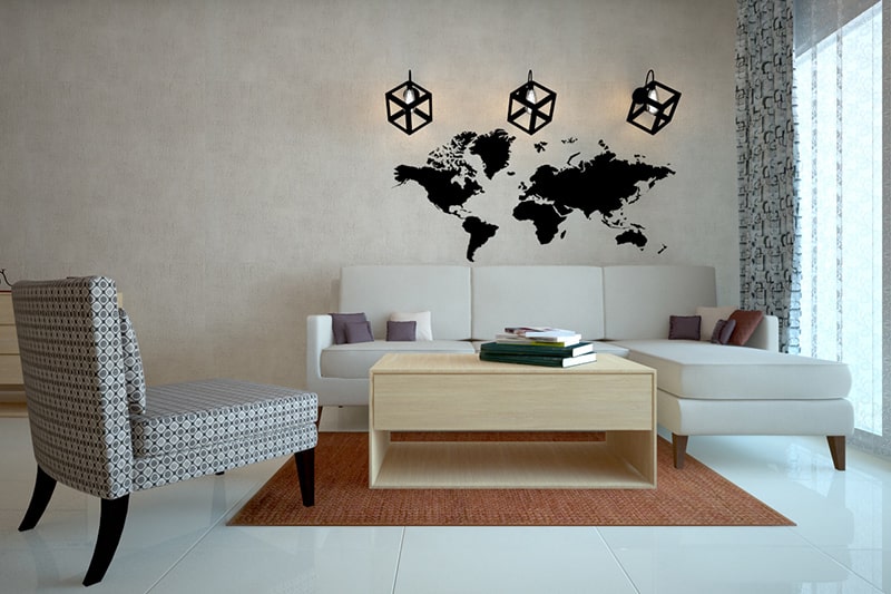 Living room wall decor that has a textured map of the world to showcase your wanderlust