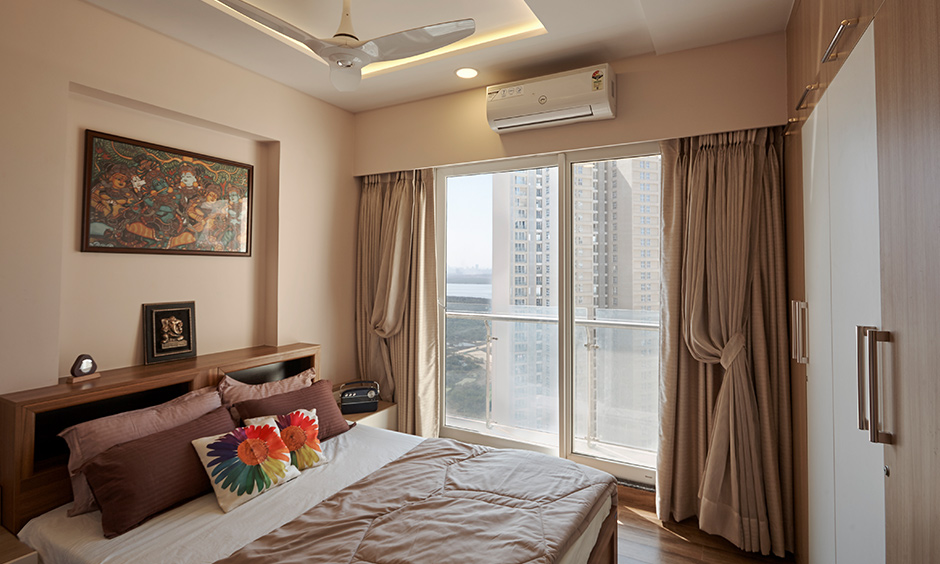 Bedroom with wardrobe designed by luxury interior designers in mumbai