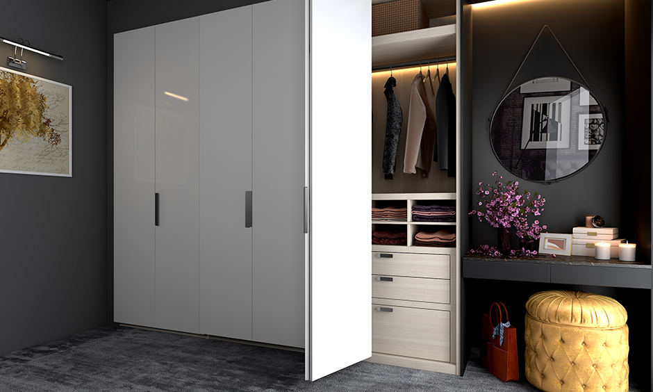 Grey master bedroom wardrobe designs with white lamination feature-rich with a host of accessories and add-ons.