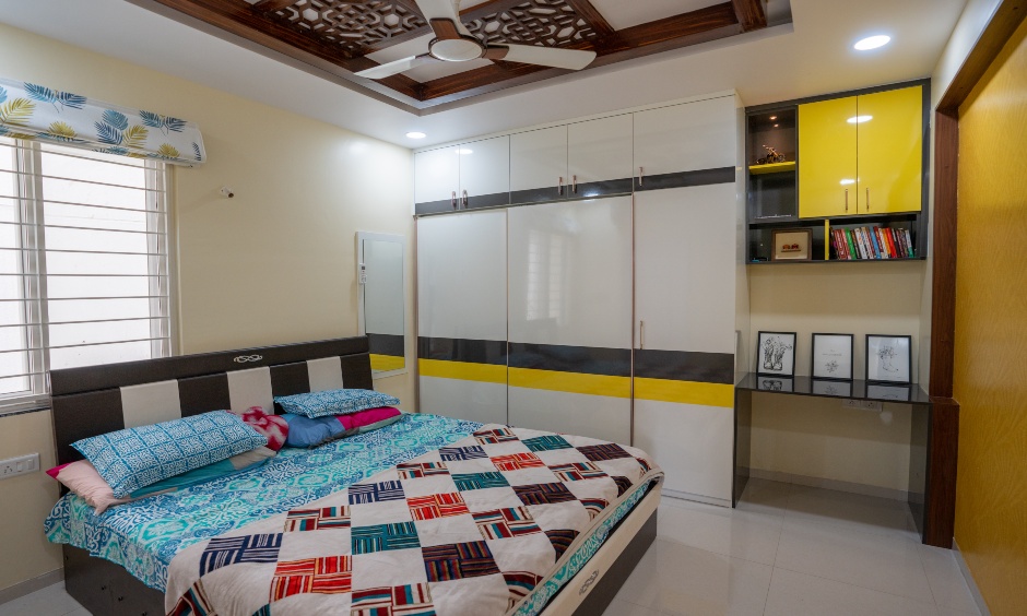 Master bedroom with floor to floor ceiling designed by interior designers in hyderabad