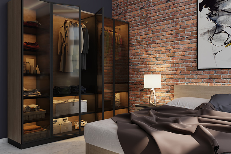 Modern bedroom wardrobe with glass shutters and iron corners with an industrial look in modern wardrobe door designs for small bedroom